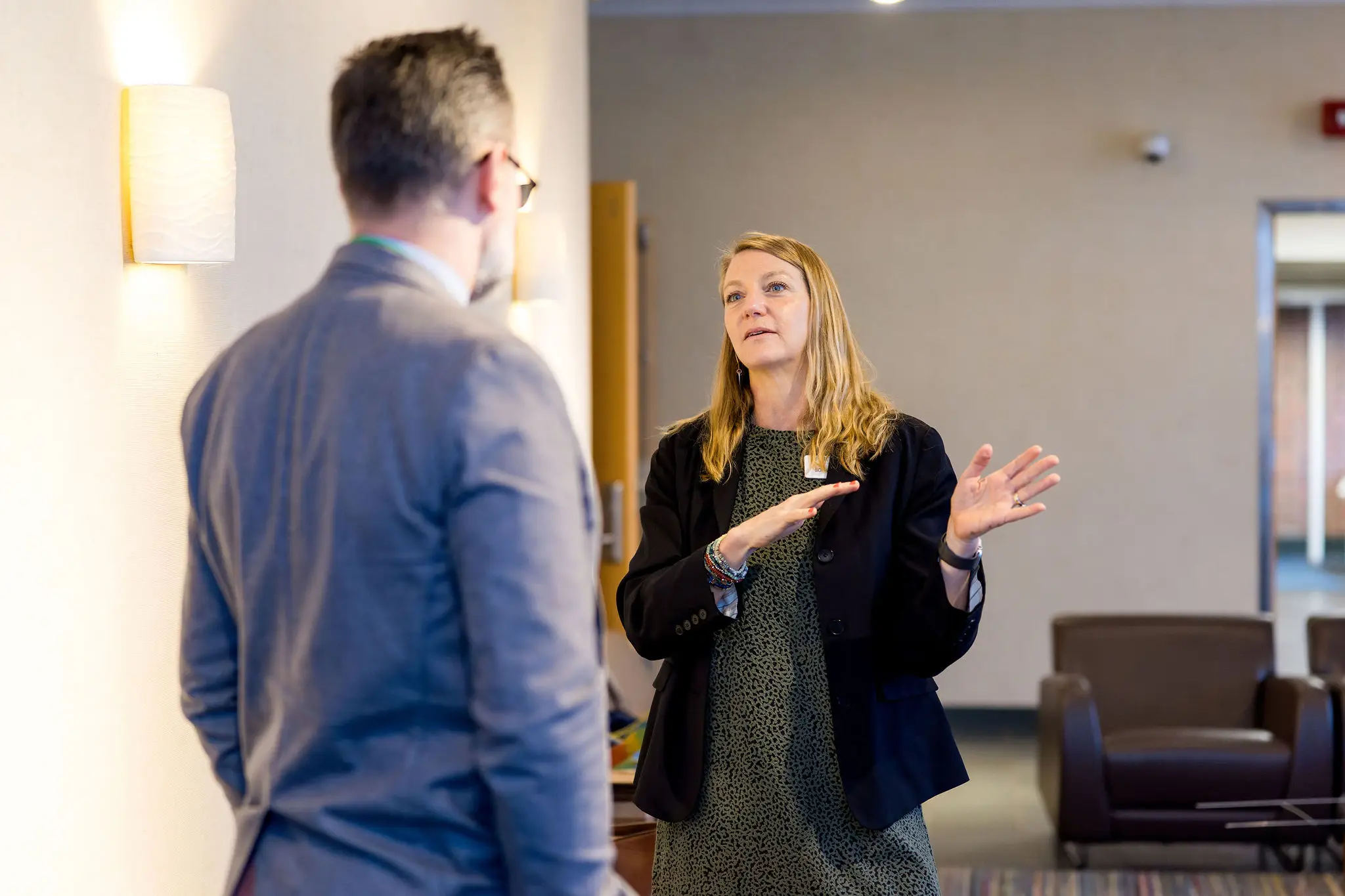 two teachers talking together in a classroom setting